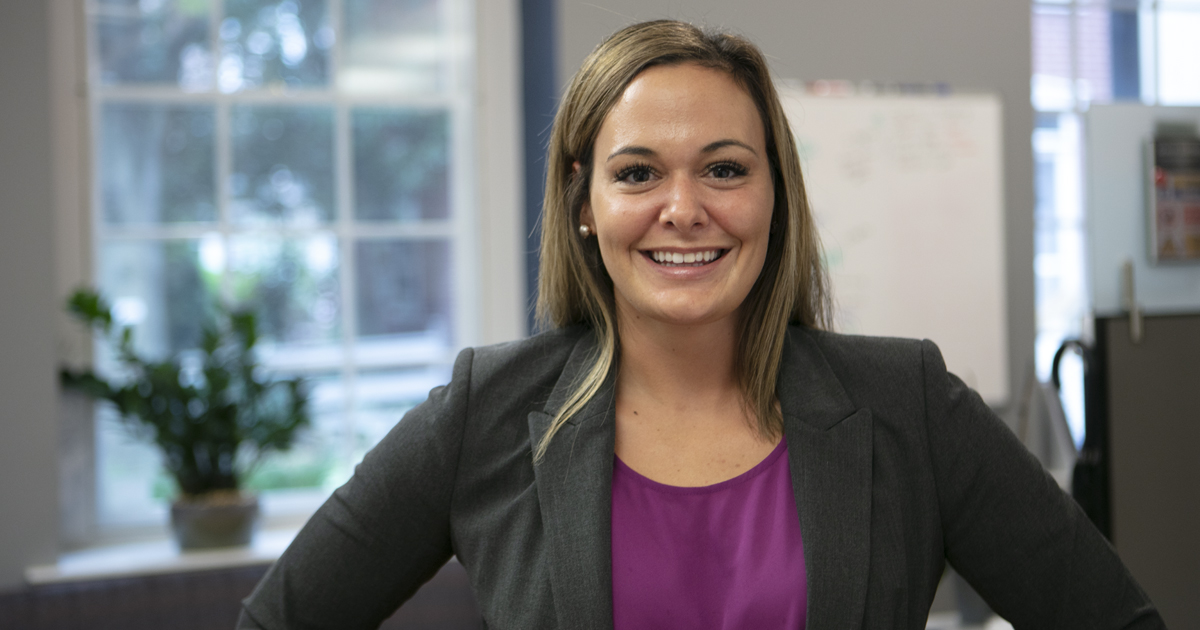 Professional woman with purple shirt