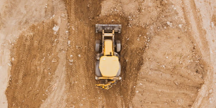 Heavy equipment working in terrain grid image
