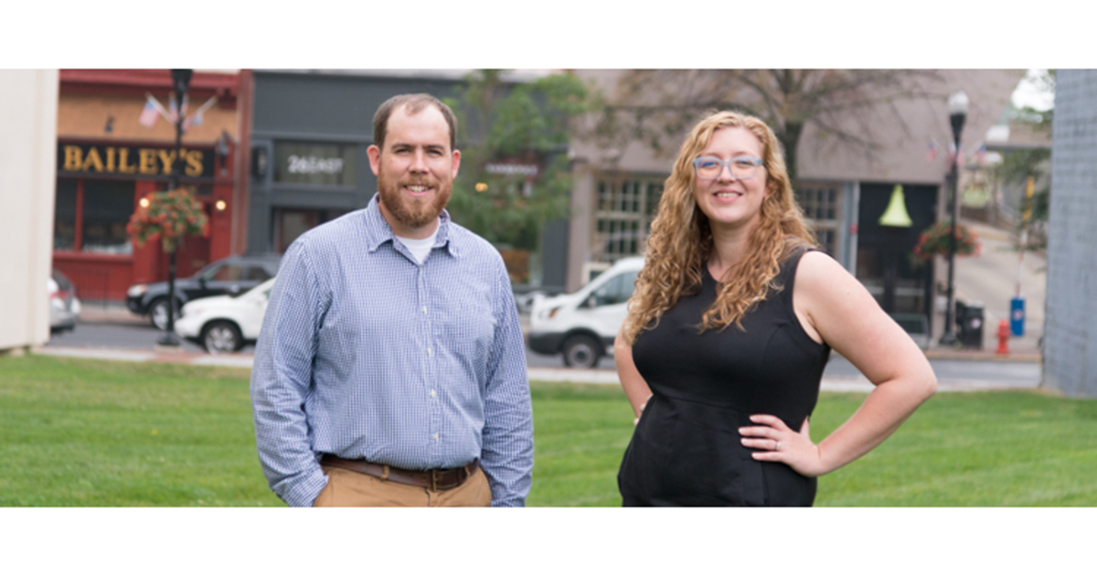 Godfrey employees Matt & Bridget standing outside