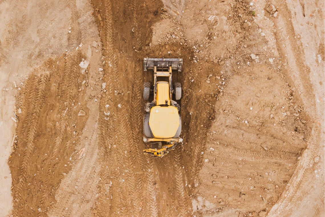 Heavy equipment working in terrain hero image