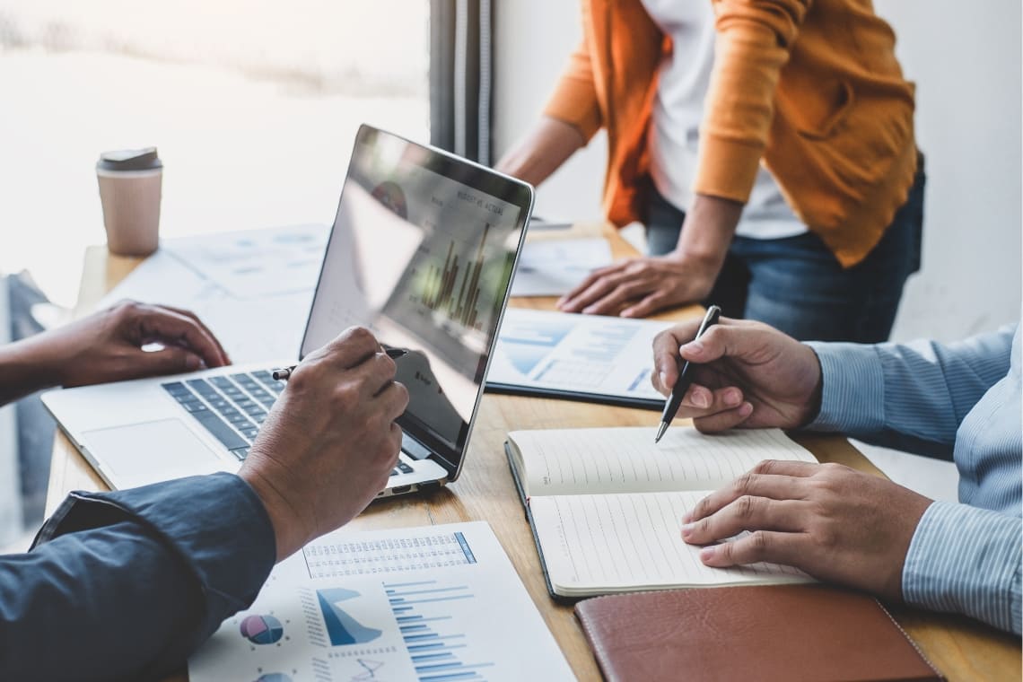 Three people working on strategy