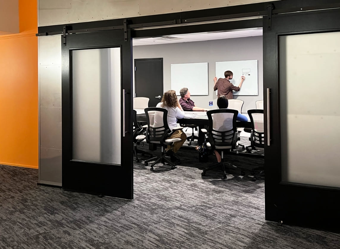 Godfrey team collaborating inside conference room