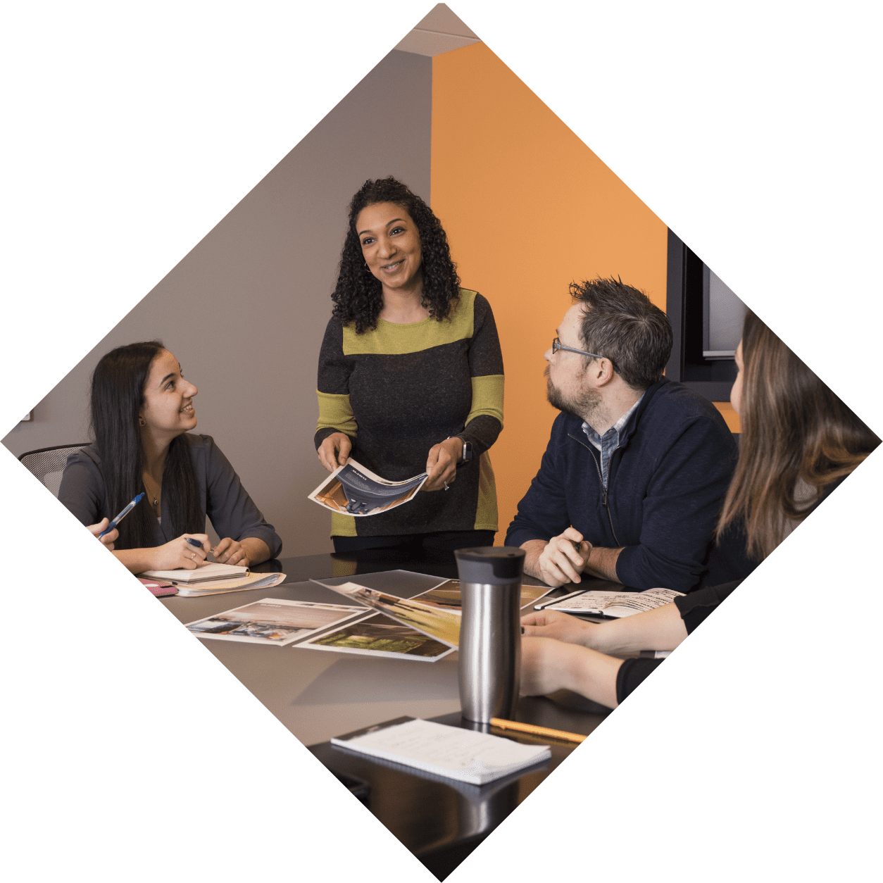 Group of coworkers discussing a project in conference room