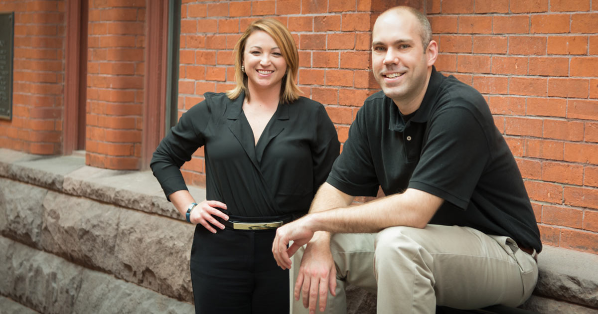 Kristi & Ruben by a wall