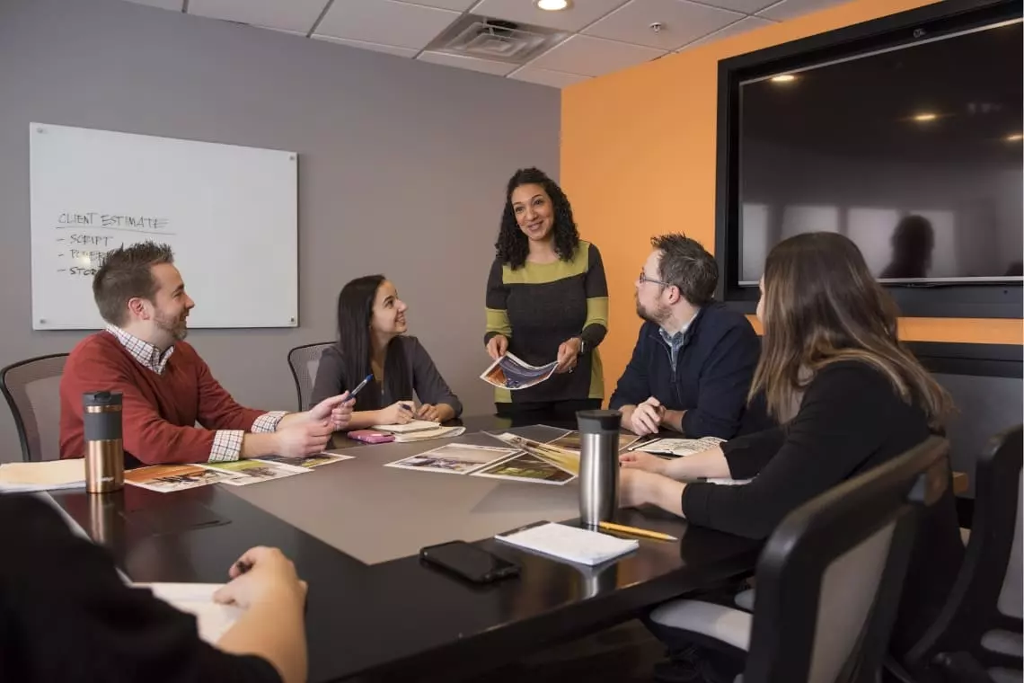 Group of coworkers discussing a project in conference room