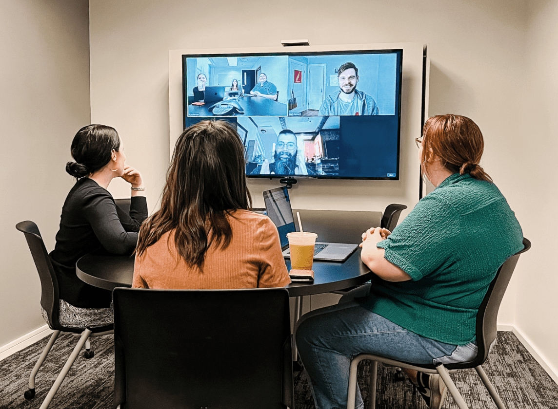 In-person and remote Godfrey teams collaborating