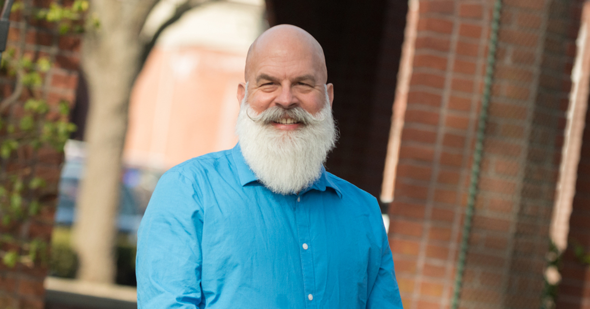 Man wearing blue button down dress shirt