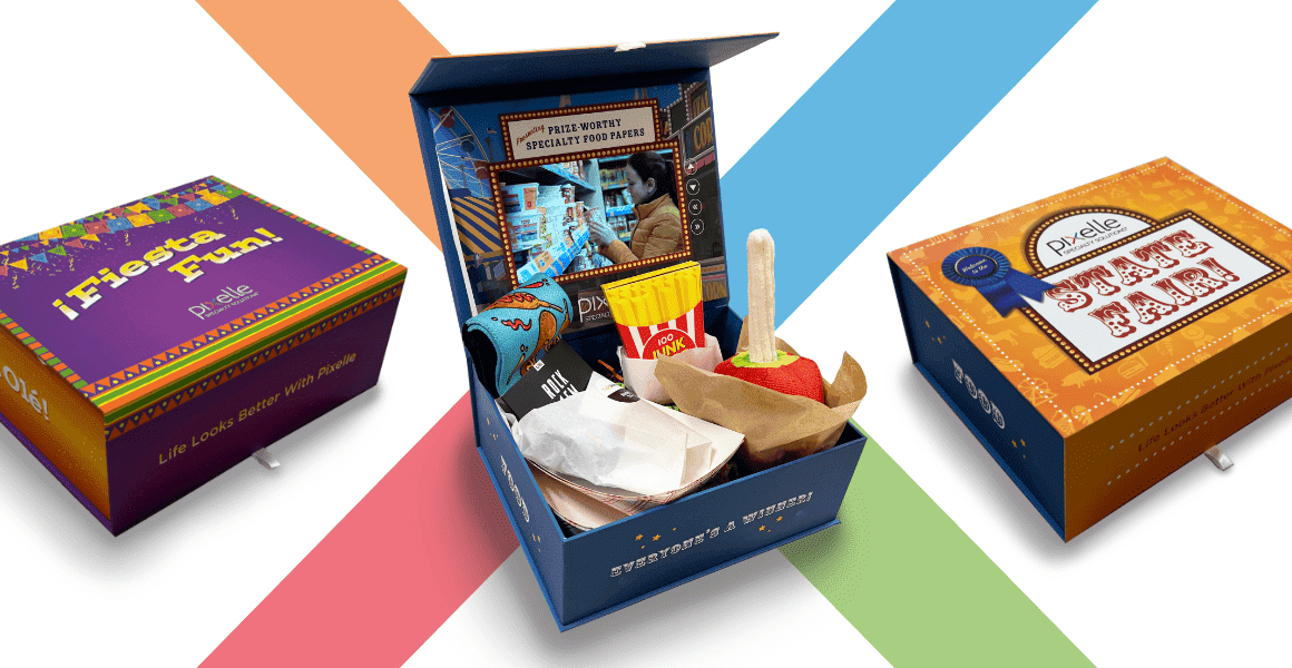 Pixelle promotional packaging includes Fiesta Fun and State Fair boxes alongside an open carnival-themed specialty paper prize kit.