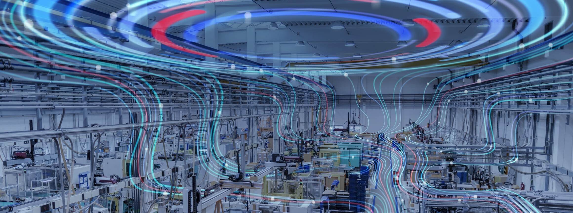 Automated factory floor overlaid with flowing blue and red digital lines, illustrating connected, intelligent factory automation.