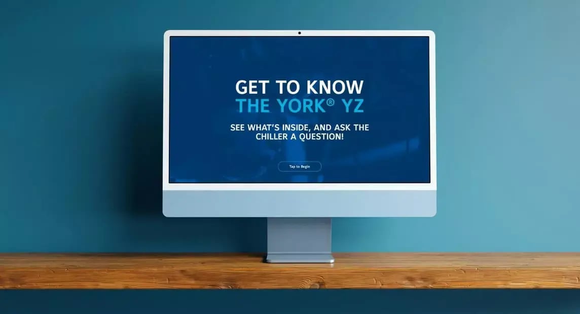 Desktop monitor displays an interactive YORK YZ chiller experience inviting users to explore the product.