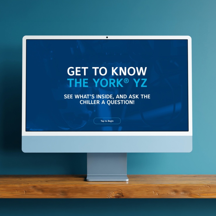 Desktop monitor displaying an interactive YORK® YZ chiller experience inviting users to explore the product and ask questions.