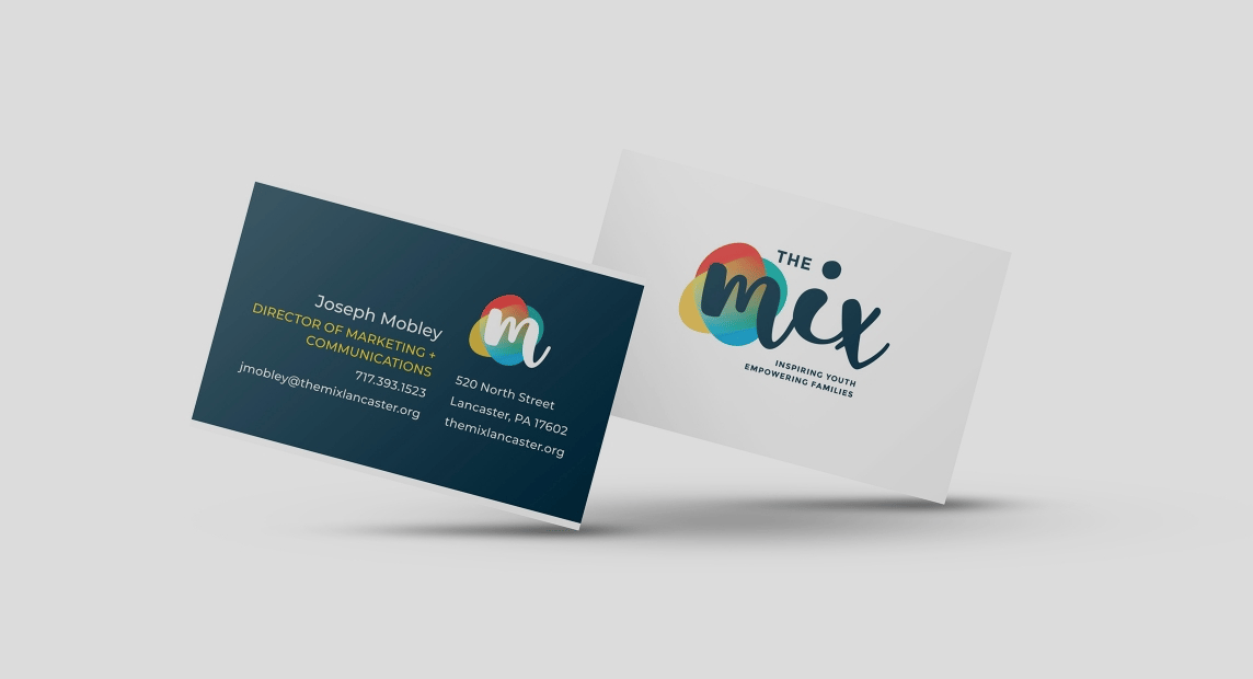 The Mix business cards showcase the colorful new logo, brand tagline and contact information on clean white and dark blue designs.