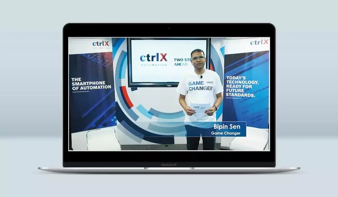 Bosch Rexroth presenter stands in a ctrlX Automation studio during a virtual product launch presentation.