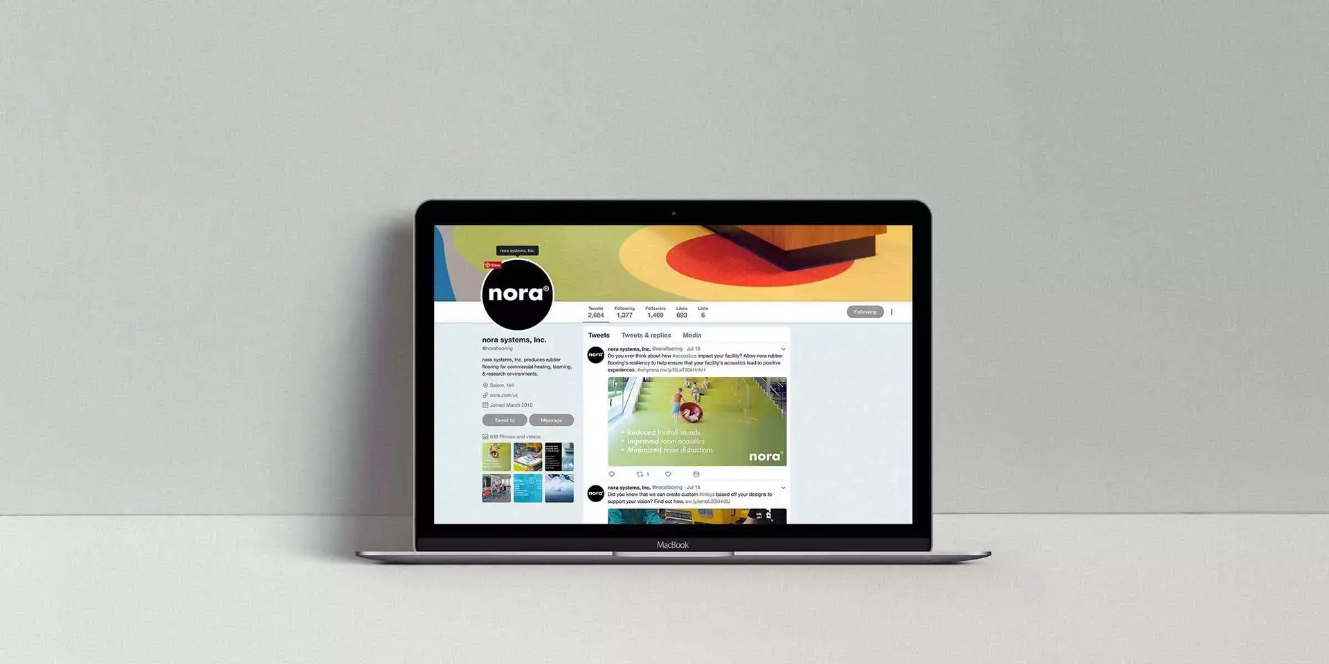 Laptop displaying the nora systems social media profile and branded posts created to increase audience engagement and online reach.