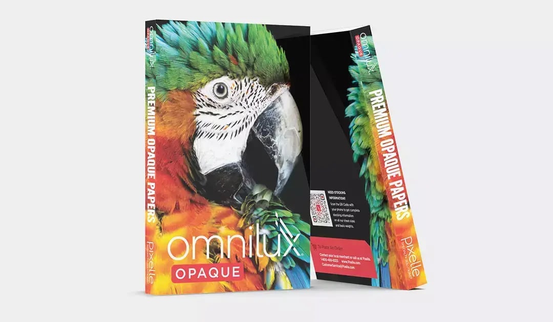 Pixelle Omnilux Opaque paper swatch books feature colorful parrot photography and bold product branding.