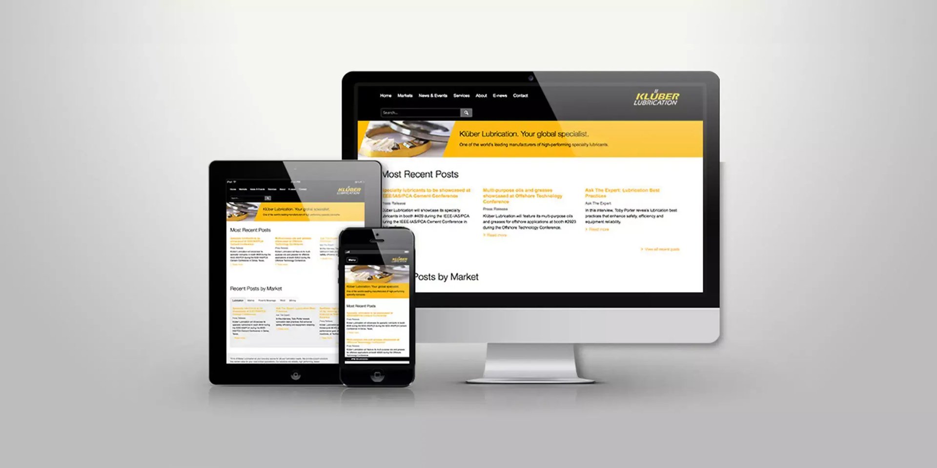 Klüber Lubrication content hub displayed on a laptop with articles and resources for industrial audiences.