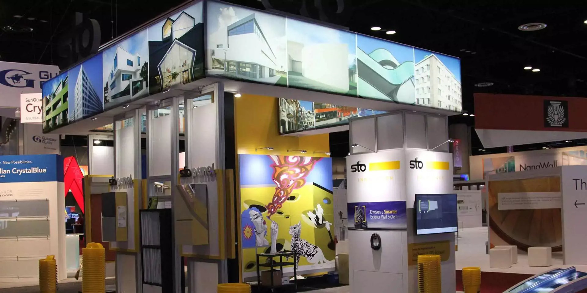 Sto trade show booth features architectural imagery, product displays and an interactive mixed reality experience for exterior wall systems.