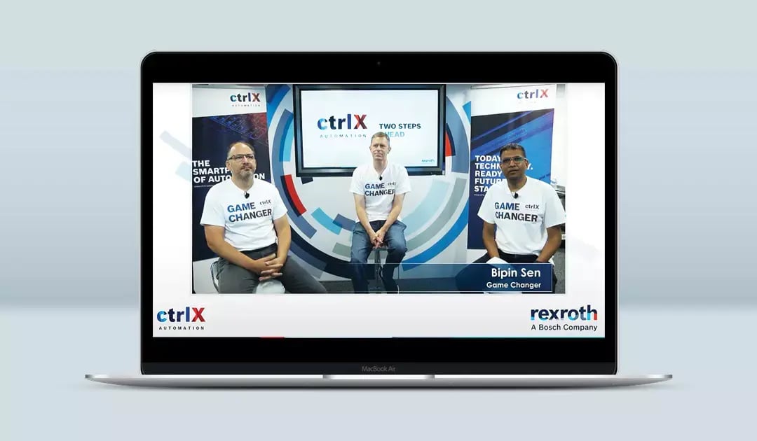 Three Bosch Rexroth presenters sit together in a branded ctrlX Automation studio during a virtual press event.