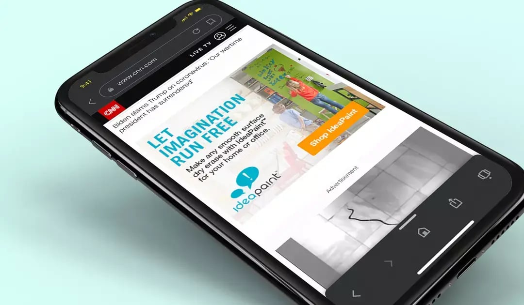 Smartphone displays an IdeaPaint ad encouraging users to turn smooth surfaces into dry erase whiteboards.