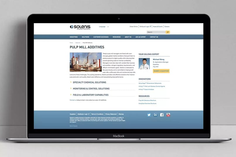 Laptop displaying the Solenis Pulp Mill Additives webpage, featuring specialty chemical, monitoring and control, and laboratory solutions.